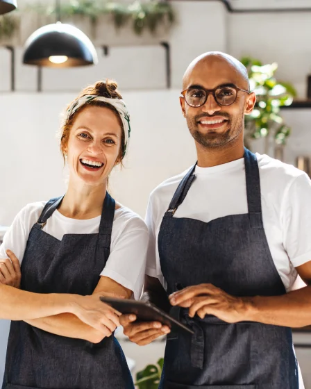Small Business owners in aprons requiring insurance