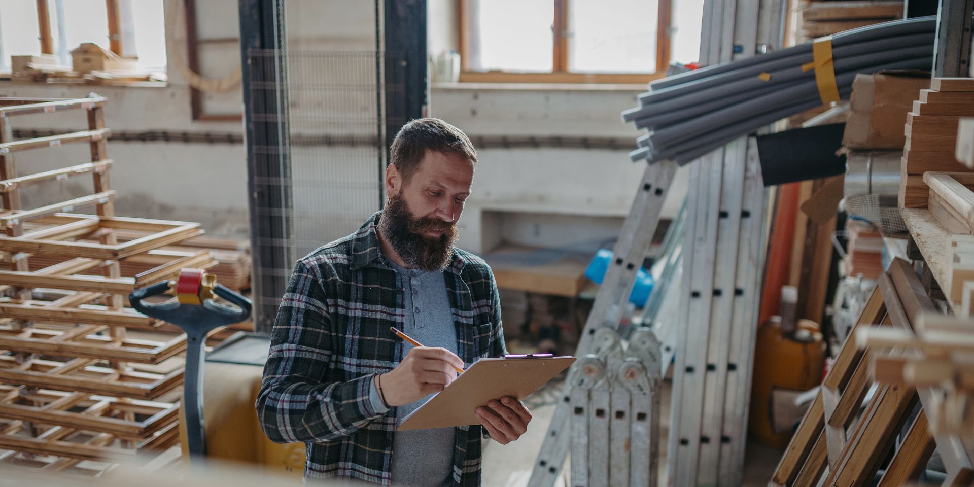 a carpenter in his workshop used on a blog about what insurance does a sole trader need?