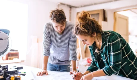 young couple working together used in bog about what insurance you need for a business