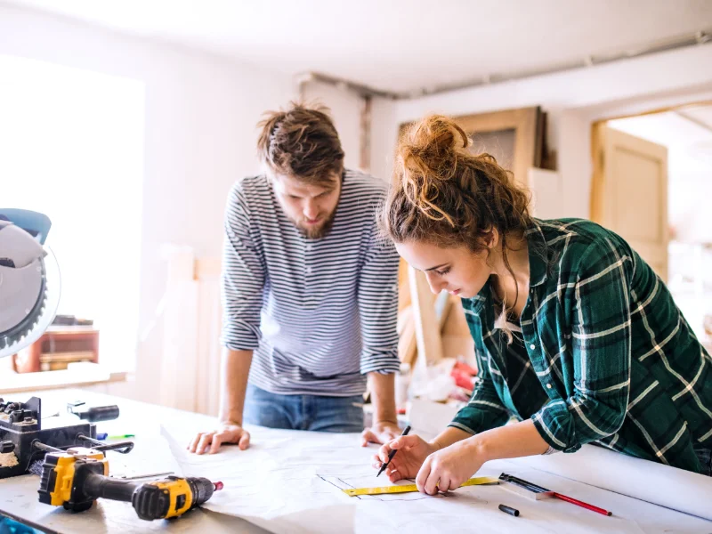 young couple working together used in bog about what insurance you need for a business
