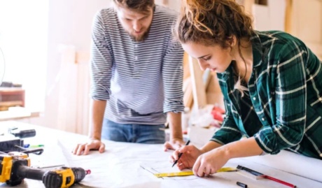young couple working together used in bog about what insurance you need for a business