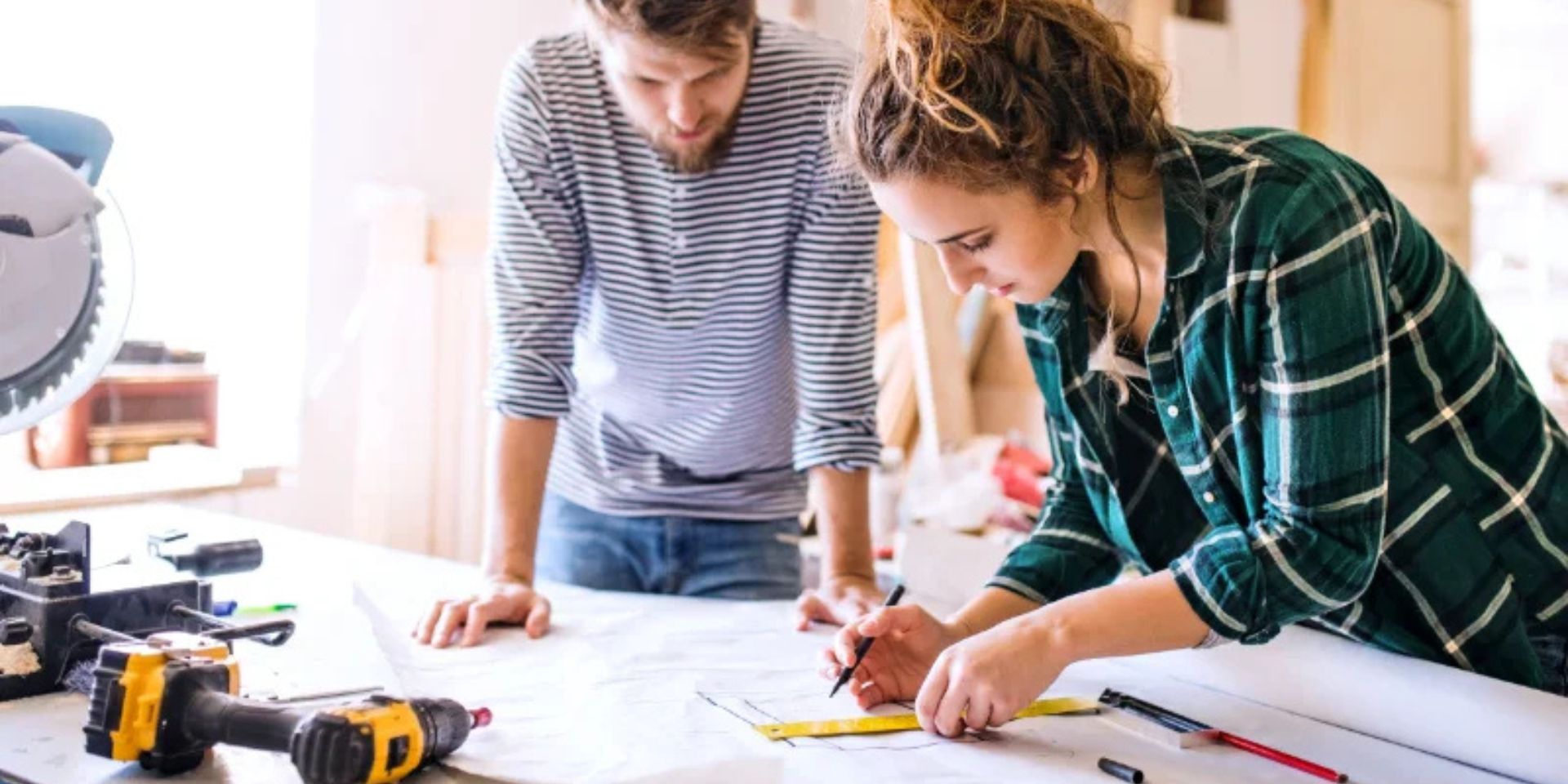 young couple working together used in bog about what insurance you need for a business