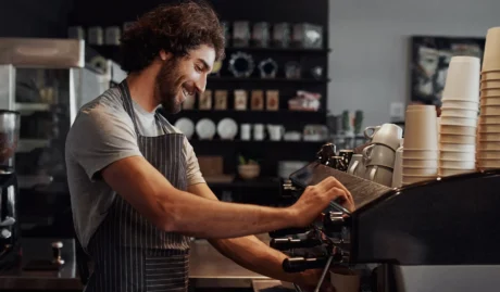 man working in a cafe Startup Business with Insurance